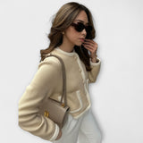 Klasičen svetlobni kardigan z elegantnimi dekorativnimi žepi