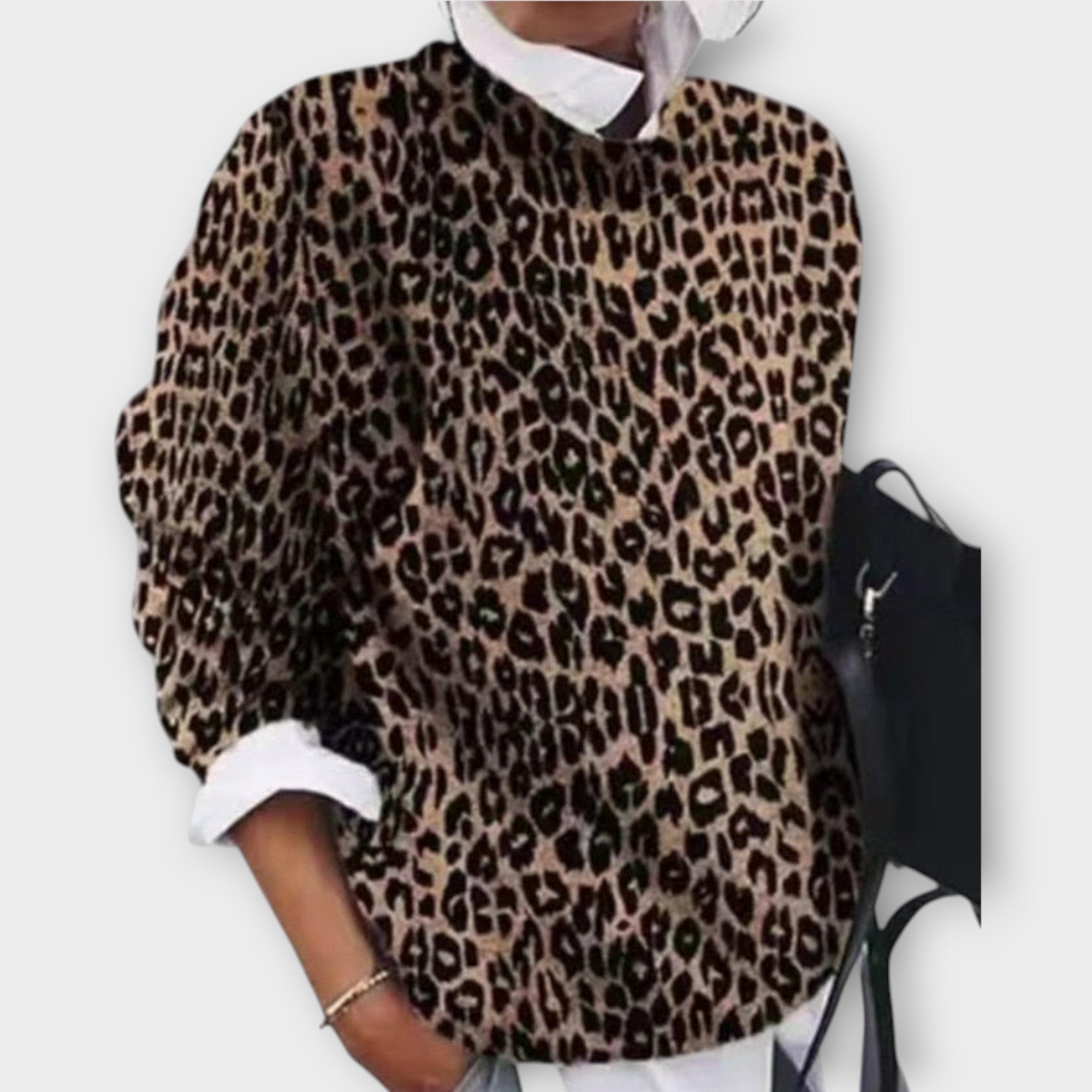 Eleganten pulover s sofisticiranimi vzorci in umetniškimi podrobnostmi